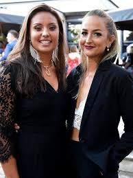 Two people _are cooking_ (cook) dinner on the beach. Adelaide Shines In Autumn The Advertiser