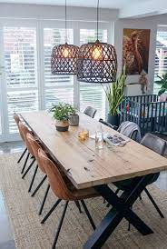 Sleek black windsor chairs juxtapose slipcovered chairs at the head of the table. Cozy Dining Table Novocom Top