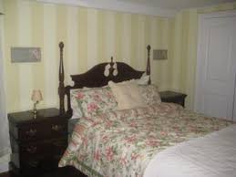 I used two colors that were next to each other on the paint strip and i absolutely loved the results. Vertical Wall Stripes In A Period Bedroom Yellow And Cream Paint Color Combination