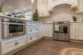 This Gorgeous Kitchen Is Homecrest Cabinets Laurent Maple French Vanilla Paint With Brownstone Glaze Homecrest Cabinets Kitchen And Bath Showroom Kitchen Sale