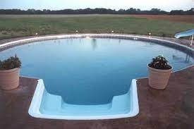 Freedom Above Ground Pool Installed Completely Inground With Colored Concrete Deck Stairs Hopper Above Ground Swimming Pools Pool Landscaping In Ground Pools