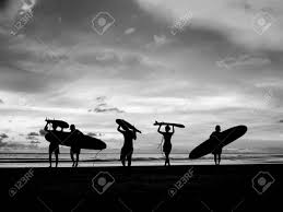Royalty free, predesigned sunset silhouette clipart illustrations. Silhouette Of Surfer People Carrying Their Surfboard On Sunset Beach Black And White Color Stock Photo Picture And Royalty Free Image Image 59720569