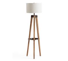 Versatile and minimalist, this contemporary guenther 61.75 tripod floor lamp showcases a unique plated gold frame with sleek stabilizing tripod legs and is crowned by crisp linen tapered shade. Miles Tripod Wood Floor Lamp Pottery Barn