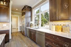 lovely kitchen features wood cabinets