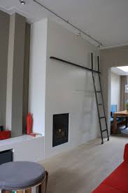 een grote kastenwand tot het plafond ruimte op interieur woonkamer inspiratie ruimtes