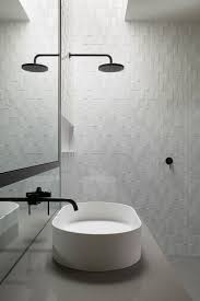 Black And White Bathroom Tiles Australia Subtly Textured Wall Minimal Matte Black Fittings Skylight Over Shower For Natural Daylight Mah Residence Mim Design Diy Bathroom Decor Bathroom Inspiration