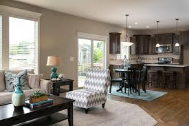 Open floor plan kitchen with different flooring. Creating Zones In Summit Homes Kc
