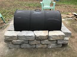 During my second or third year my dad and one of my den leaders, steve, came up with a design for a fire pit, and a grill. Inexpensive Fire Pit Made From A 55 Gallon Drum A Grate From Northern Tool And Blocks From Lowe S 55 Gallon Drum Fire Pit Camping Fire Pit