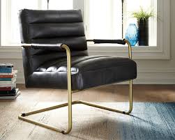 Wowing With Luminous Goldtone Metal And Sleek Black Faux Leather The Hackley Accent Chair Takes A Cool Stanc Living Room Chairs Ashley Furniture Accent Chairs