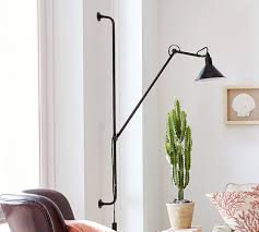 Install a coordinating pair on either side of the console table in the entryway to add a little illumination. Leighton Adjustable Wall Sconce Pottery Barn