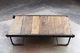 Inspired by vintage industrial design, the austin antique bronze round coffee cocktail occasional table features beautiful design with mdf wood top and solid metal iron base. Vintage Industrial Steel And Wood Skid Platform Low Coffee Table For Sale At 1stdibs