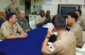 Seated left to right are, US Air Force (USAF) First Lieutenant ...