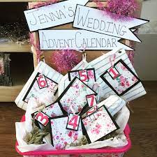 Form the shape of a christmas tree with envelopes in various sizes, and mark each with adhesive numbers. Wedding Advent Calendar What S Inside Jenna Suth