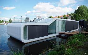 Where are houses built on stilts over the water? Beautiful Modern Water Villa Sets Sail In Amsterdam