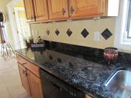 Blue Volga Granite From Ukraine Tumbled Marble Backsplash With Granite Accents Kitchen Renovation Updated Kitchen Kitchen