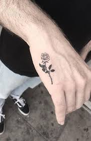 Get daily tattoo ideas on socials. Simple Black Rose Tattoo Idea