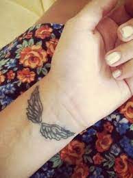 Angel wings, guardian angel, cherub, st. 15 Angel Wing Tattoo Designs To Try Pretty Designs Wing Tattoos On Wrist Tattoos Neck Tattoo