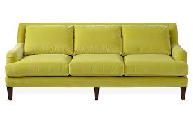The chairs are upholstered in bright green fabric and feature solid dark wood. One Kings Lane Merrimack Sofa Chartreuse Velvet One Kings Lane