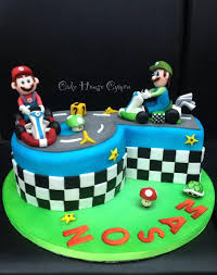 Mario exploded out of the chocolate mud cake decorated in the mario world scene with the 7 cube in his hand. 6th Birthday Cake Mario Luigi Cake Mario Kart Cake Luigi Cake Mario Birthday Cake