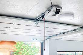 The workhorse bu100 garage door opener is universal and can go either with an 8'x7′ single door or with a 16'x7′ double door. Opening Door And Automatic Garage Door Opener Electric Engine Gear Mounted On Ceiling With Emergency Cord Double Place Empty Garage Interior With Rolling Entrance Gate Stock Photo Picture And Royalty Free Image
