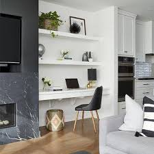 The main hall has custom wood trusses that bring the feel of the 16' tall ceilings down to earth. Fireplace Floating Shelves Design Ideas