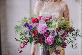 Garden roses, ranunculus, blue tweedia and snap dragon; Free Form A New Style Of Bridal Bouquet
