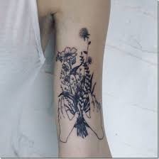 This simple floral design is truly gorgeous especially because of the color. Splendid Bouquet Of Flowers Tattoo Designs Nexttattoos