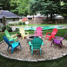 Stone Pit With A Rainbow Of Chairs Awesome Firepit Area Ideas For Your Outdoor Activities In 2020 Easy Backyard Landscaping Backyard Fire Pit Backyard