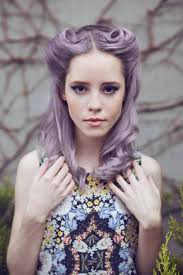 This pin up hairstyle with bangs creates height at the top of the head and uses bangs instead of curls to frame a delicately feminine face. Vintage Pin Up Hairstyles For Long Hair Folade