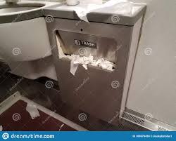 sink and trash can in bathroom on train