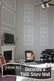A Little Of This A Little Of That Decorating A Two Story Wall Tall Wall Decor Family Room Walls High Ceiling Living Room