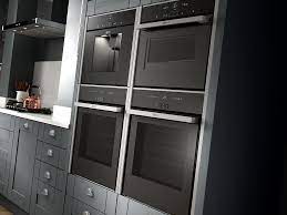 The cooking appliances include single and double ovens; Ovens Benchmarx Kitchens Joinery