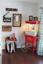 If you're serious about creating your own media or movie room, take the time to research the best seating, audiovisual equipment and even wall paint colors. Decorate Your Family Room With Movie Theater Themed Decor For A Fun Mini Theater Room Experience Fun Movi Media Room Decor Home Cinema Room Theater Room Decor