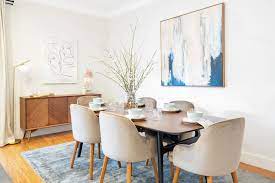The gray seat cushions of these dining chairs create a nice contrast with the dark brown wood of these chairs and table. Mid Century Modern Why We Can T Get Enough Of This Furniture Style Castlery United States
