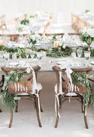 Mrs Mr Garland Topped Sweetheart Chairs Http Www Stylemepretty Com Michig Wedding Chair Decorations Rustic Wedding Chair Decorations Wedding Chair Signs