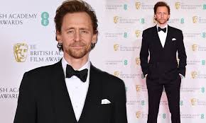 The 2021 british academy film and television awards took place. Bafta 2021 Film Awards Tom Hiddleston Looks Dapper In A Sharp Suit And Bowtie On The Red Carpet Daily Mail Online