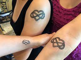 This is a torii, a traditional japanese gate, that symbolizes the transition from the profane to the peace symbol tattoo. A Tattoo Polyamory