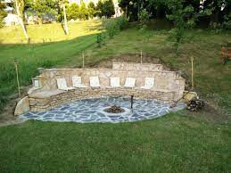 The pit itself is lined with concrete block, and you'll need fire brick to protect the block. They Built A Fireplace Into Their Sloping Hillside The Results Were And Are Stunning Outside Fire Pits Backyard Fire Sloped Backyard