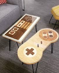 The coffee game table is 32″ by 48″ overall, with an interior play area of 24″ by 40″, and 4 inch edges all around. Google Bought Game Controller Cocktail Tables