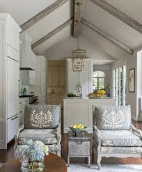 A new home's great room ceiling is made stunning with modified king trusses. Remodeled White Kitchen With Vaulted Ceiling Beams Home Bunch Interior Design Ideas