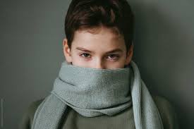 Young Boy With Wool Scarf." by Stocksy Contributor "Irina Polonina"