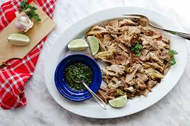 Place the pork and some marinade in a baking dish. Super Moist Cuban Puerco Asado Bon Appet Eat