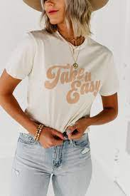 The Take It Easy Graphic Tee Ivory Trendy Shirt Designs Graphic Tee Outfits Trendy Tshirts