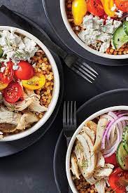 Couscous mixed with garlic, topped with a fresh salad of feta, cucumbers, and tomatoes, and served with a creamy choose from 21 fresh recipes featuring steak, chicken, pork, fish, vegetarian options, and beyond to meet. Mediterranean Chicken And Couscous Bowls Recipe Cooking Light Recipe Chicken And Couscous Couscous Bowl Mediterranean Chicken