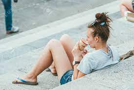 Guitar photograph on flip flops. Moscow Russia June 1 2014 A Young Woman Is Sitting On The Stock Photo Picture And Royalty Free Image Image 146808050