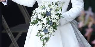 It is arranged in a way that it looks like the flowers are flowing or dropping out of the bride's hands towards her feet. Princess Eugenie S Wedding Flowers Are A Celebration Of Fall