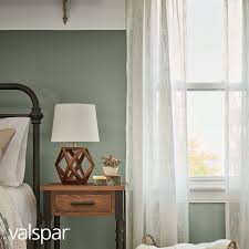 Soft Green Walls And Wood Accent Furniture Bring The Healing Energy Of The Outdoors Into This Green Bedroom Walls Bedroom Wall Colors Accent Wall Bedroom Paint