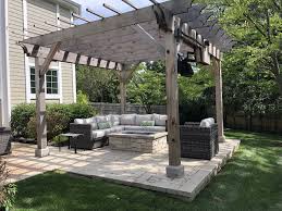 An outdoor structure can be the perfect way to enjoy al fresco living on comfortable patio furniture. Pergola Paver Patio Custom Stone Fire Pit Northbrook Il Northbrook Decks Pergolas Stone Paver Patios
