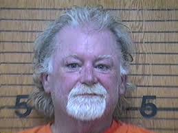 Man arrested after allegedly pointing gun in street near Walmart