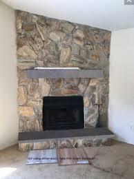 Paint the fireplace in contrasting deep charcoal gray to produce an. Help Me With My Giant Stone Fireplace